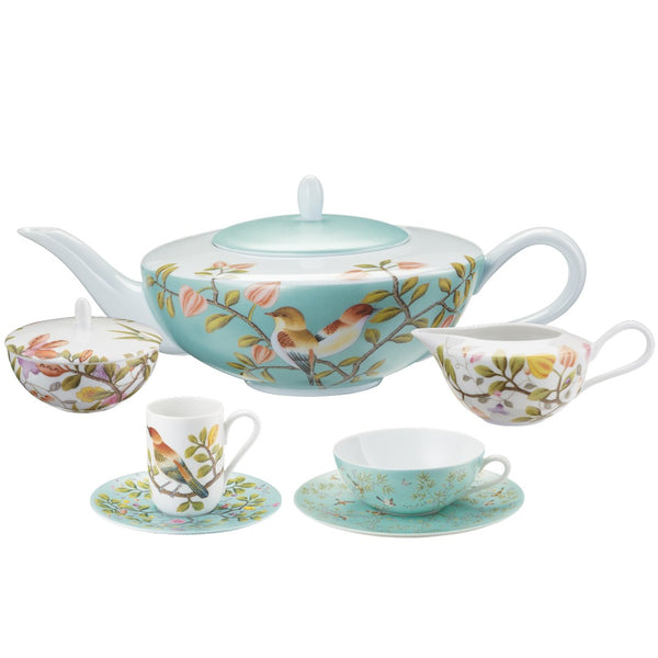 Tea set with floral and bird design on a white background