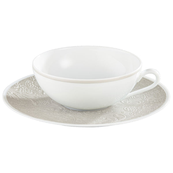 Italian Renaissance Irisé Pearl Grey tea cup and saucer by Raynaud in Limoges porcelain with engraved arabesques and pearl grey iridescence.