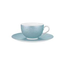 Light blue textured teacup and saucer set on a white background