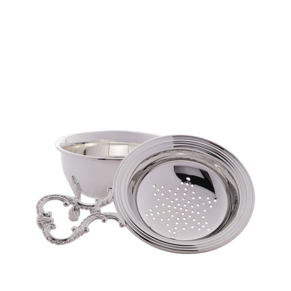 silver-plated tea strainer with drip bowl by Greggio on white background