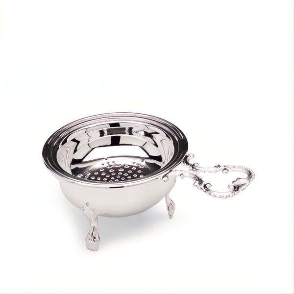 silver-plated tea strainer with drip bowl by Greggio on white background