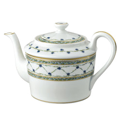 A white porcelain tea pot with blue and gold floral patterns, featuring a lid and a handle.