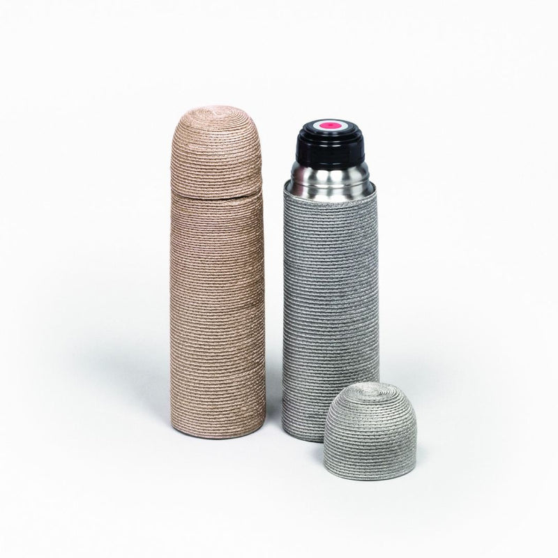 Two Techstraw thermos bottles, one beige and one silver with black lid, on a white background b Pigment France
