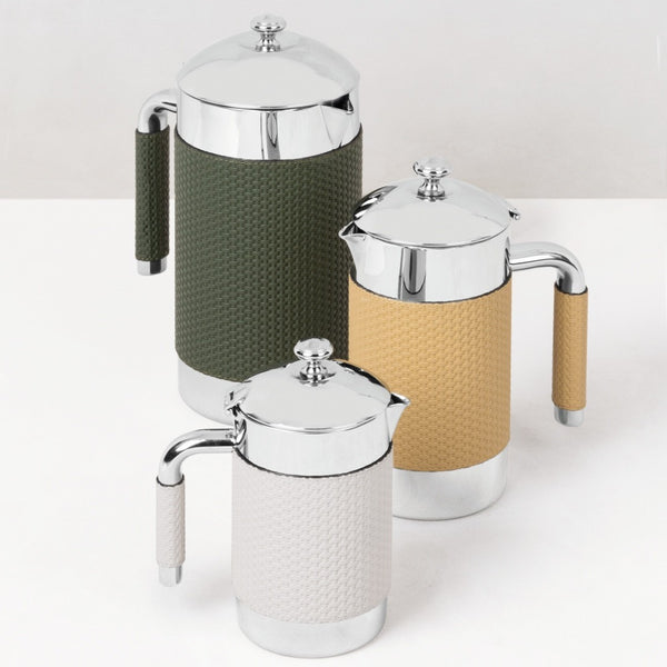 Three thermal carafe pacific with textured green, beige, and white bodies on a white background