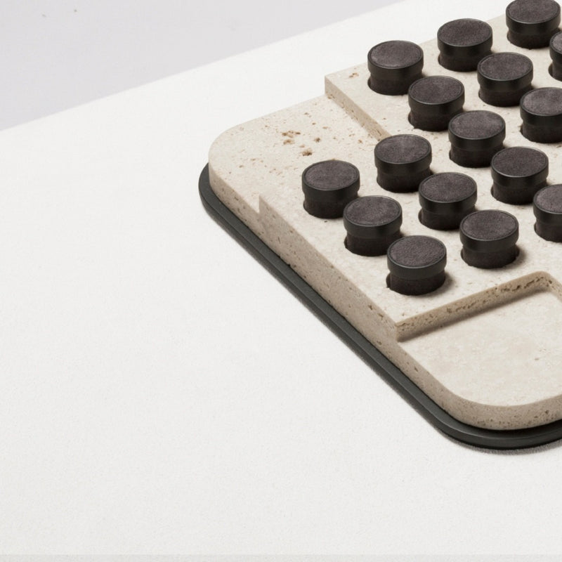 Detail of Tivoli marble solitaire game set square with leather-inlaid metal pieces by Giobagnara