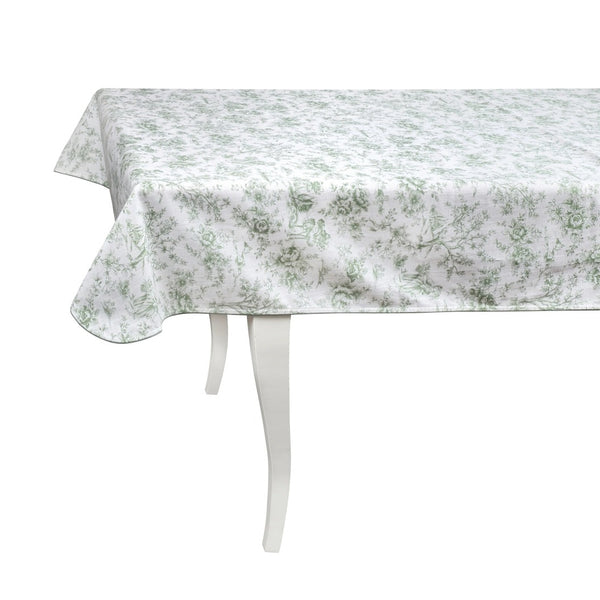 A green and white floral-patterned cotton tablecloth laid out on a white dining table with a white frame.