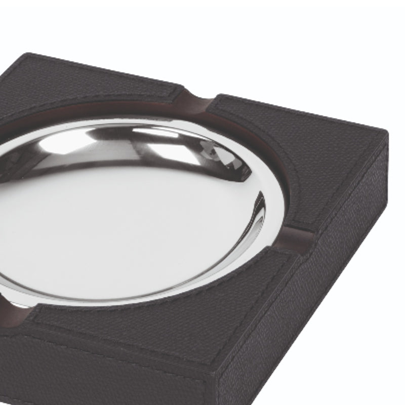Close-up of trafalgar leather ashtray by giobagnara with removable chrome basin