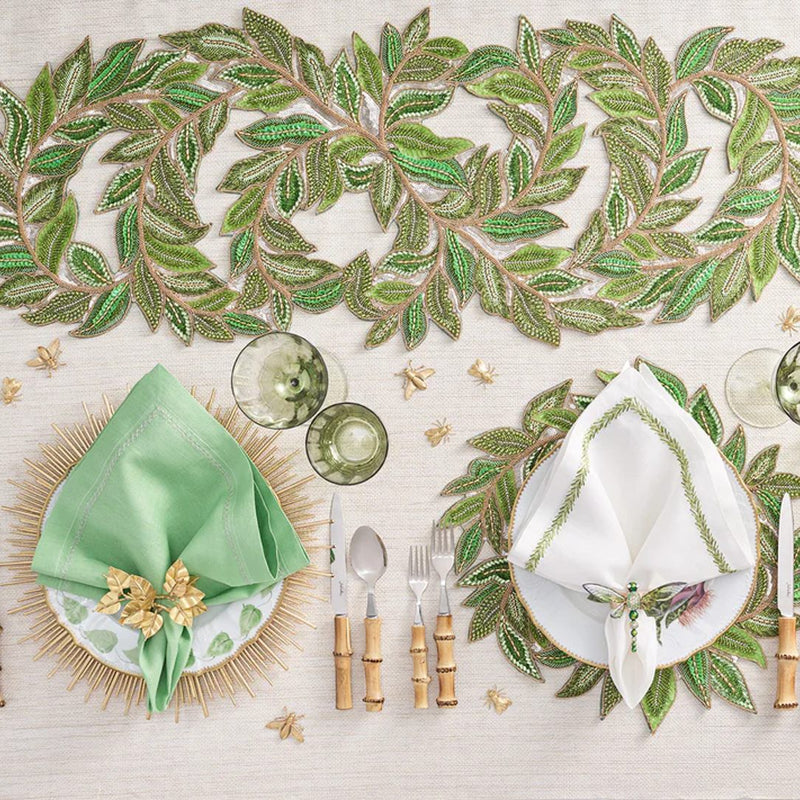 green trellis pattern on table runner and placemats styled with plates