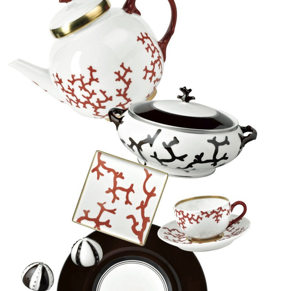 Ceramic tea set featuring a trinket tray in porcelain from Cristobal Rouge collection with red and black patterns on a white background