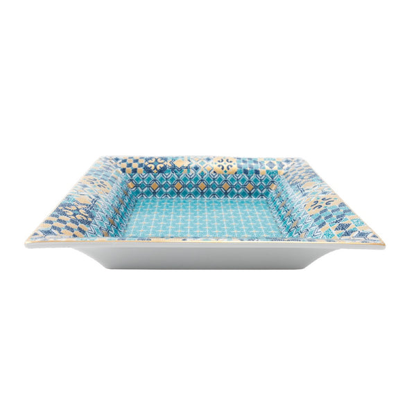 Square ceramic plate with blue and white geometric pattern on a white background