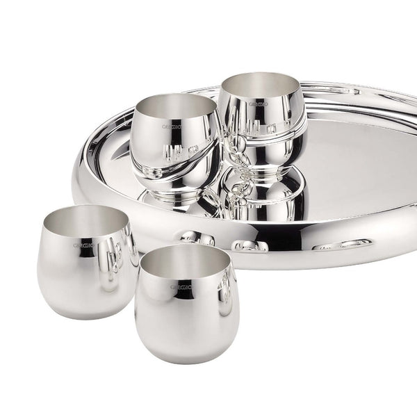 Set of elegant round silver-plated water and cocktail tumblers by Greggio and a tray on a white background