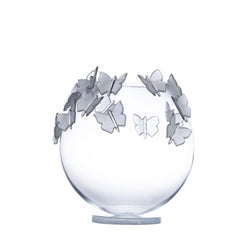 Clear glass vase with butterfly decorations on a white background