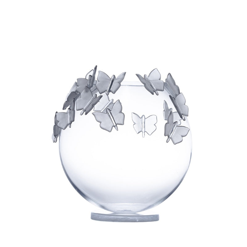 Clear glass vase with butterfly decorations on a white background