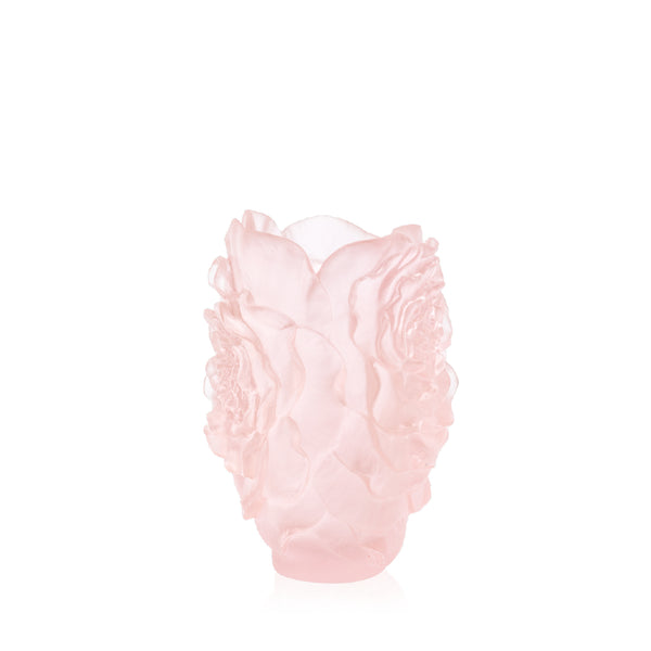 A pink crystal vase designed in the shape of a camellia flower, with a smooth and delicate finish.