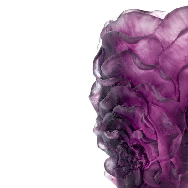 Close-up of a purple glass flower on a white background