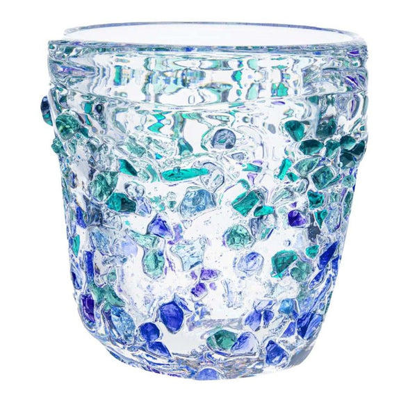 Glass vase with blue and green speckled pattern on a white background