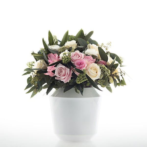 Medium Luna White porcelain vase by Sieger by Fürstenberg styled with flowers 


