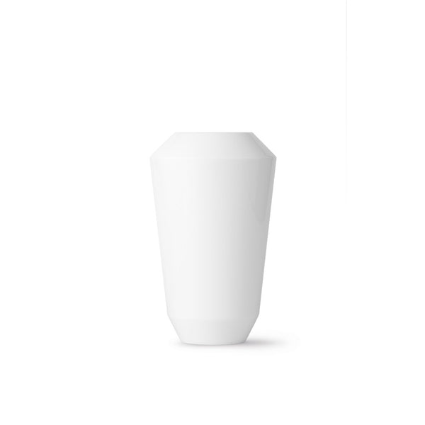A white, cylindrical porcelain vase with a smooth surface.
