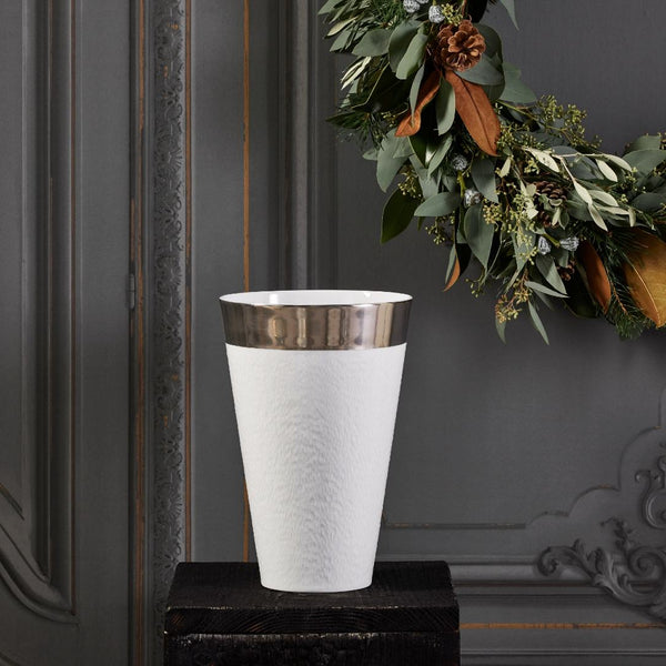 vase mineral white and platinum rim styled in front of a grey wall with plants