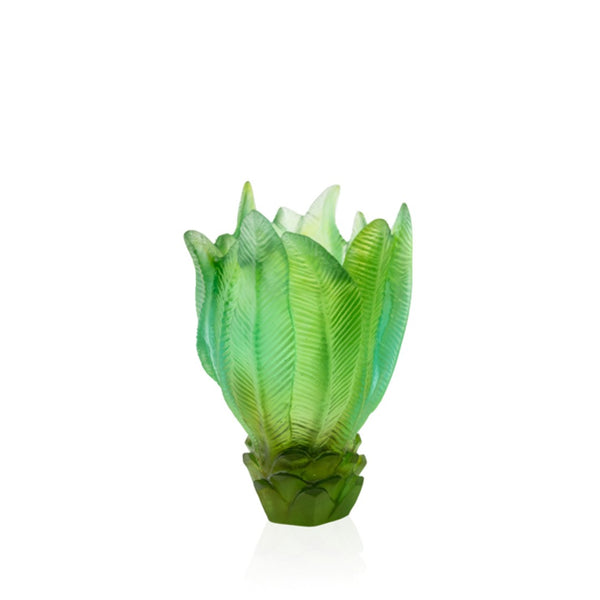 Green glass sculpture on a white background
