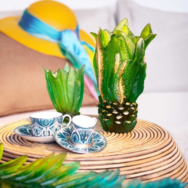 styled coffee table with the Vase Palm Beach crystal green small by Daum, pâte de verre vase with sculpted palm leaves