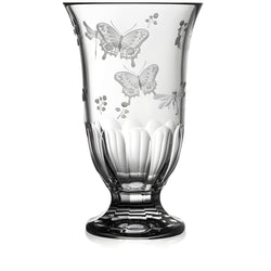 Clear glass vase with butterfly etchings on a white background