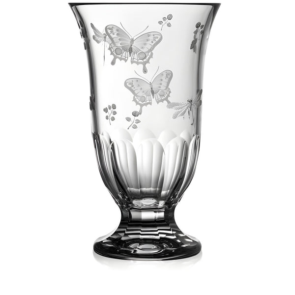Clear glass vase with butterfly etchings on a white background