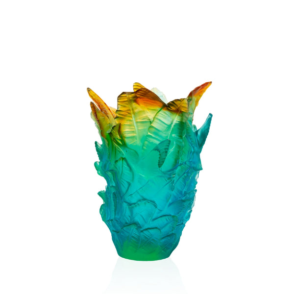 A tropical ombre crystal vase with vibrant blue, yellow, and green hues, handmade by Daum.