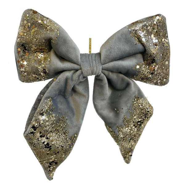 Gray velvet bow with gold glitter by Shishi, used as a hanging Christmas ornament or elegant napkin decoration.