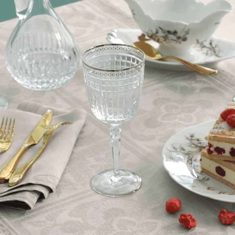 Styled table with Aghata Platinum crystal water glass with geometric bevel cuts and platinum rim by Cristallerie de Montbronn