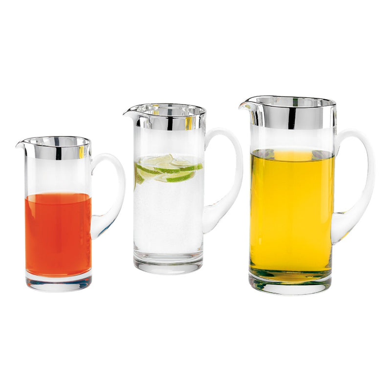 Three Luxury Crystal Water Jug Babsy  with 1.8 cm Fine Silver Rim – Sonja Quandt with different colored liquids on a white background