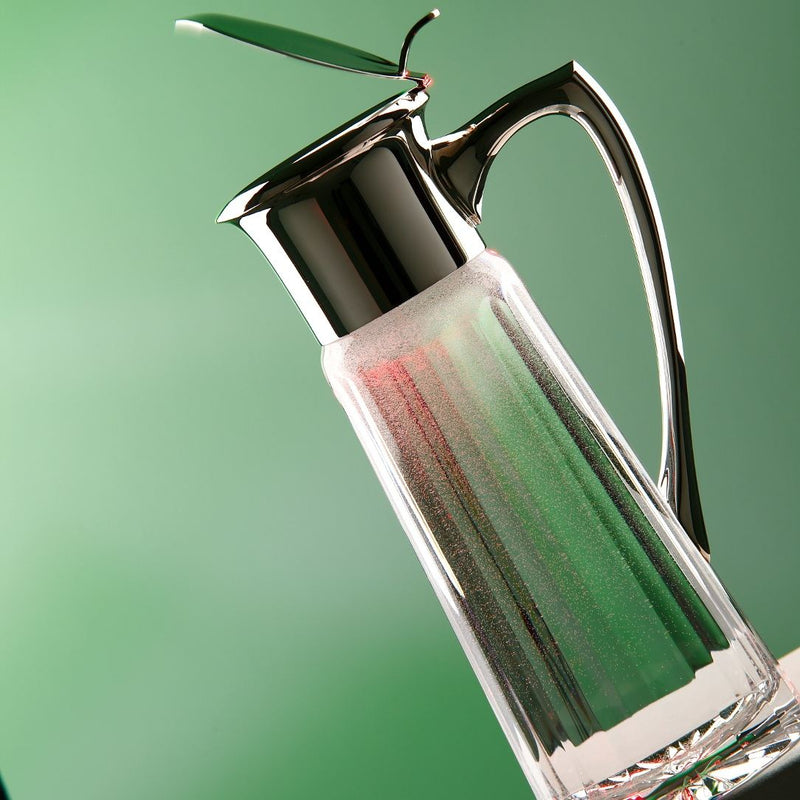 Styled Luxury water jug Opera in sterling silver and cut crystal with hinged lid and handle by Sonja Quandt – elegant pitcher for refined dining.