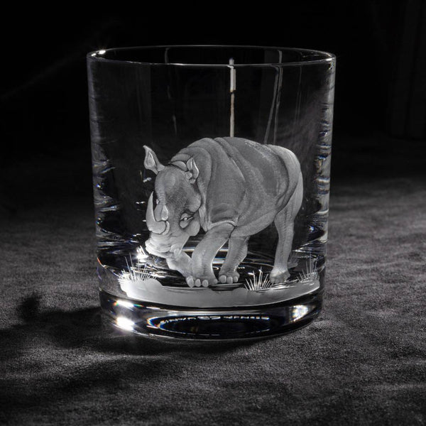 Luxury Crystal Whiskey Glass with Rhino Engraving – Big Five Collection by Sonja Quandt on a dark surface