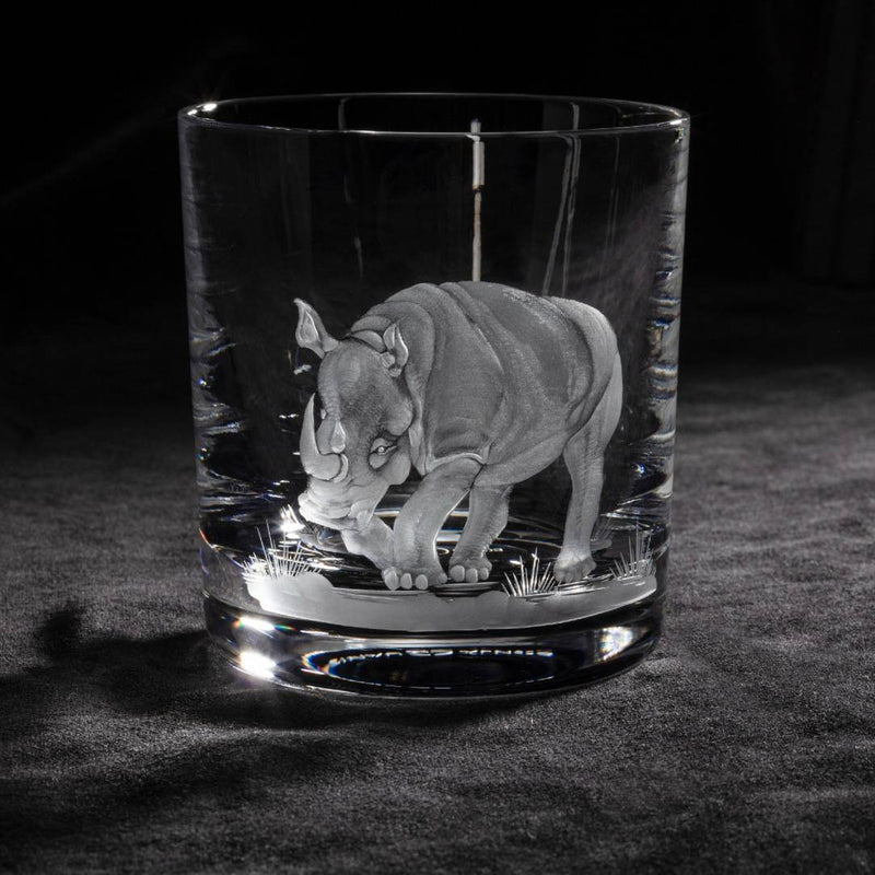 Luxury Crystal Whiskey Glass with Rhino Engraving – Big Five Collection by Sonja Quandt on a dark surface