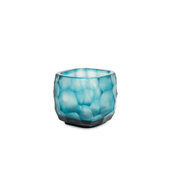 Blue glass candle holder on a white background