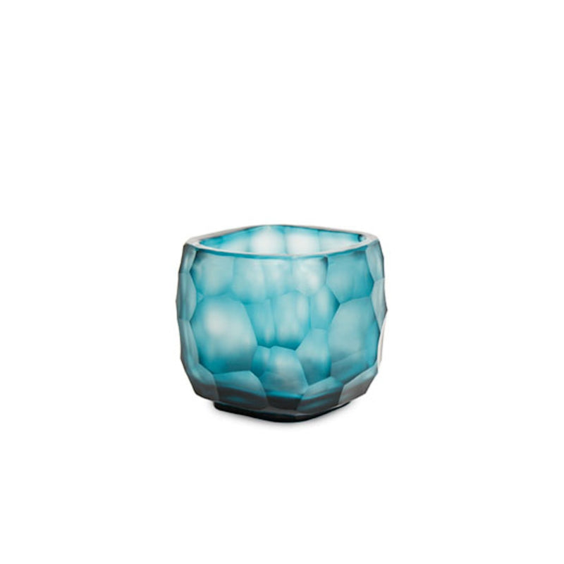 Blue glass candle holder on a white background