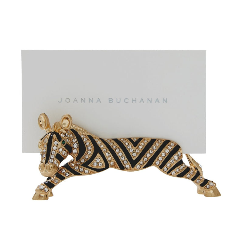 Zebra-shaped card holder with gold and black stripes on a white background