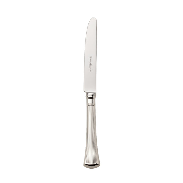 Silver-plated Avenue table knife with polished blade and sculpted ridges on elegant table.