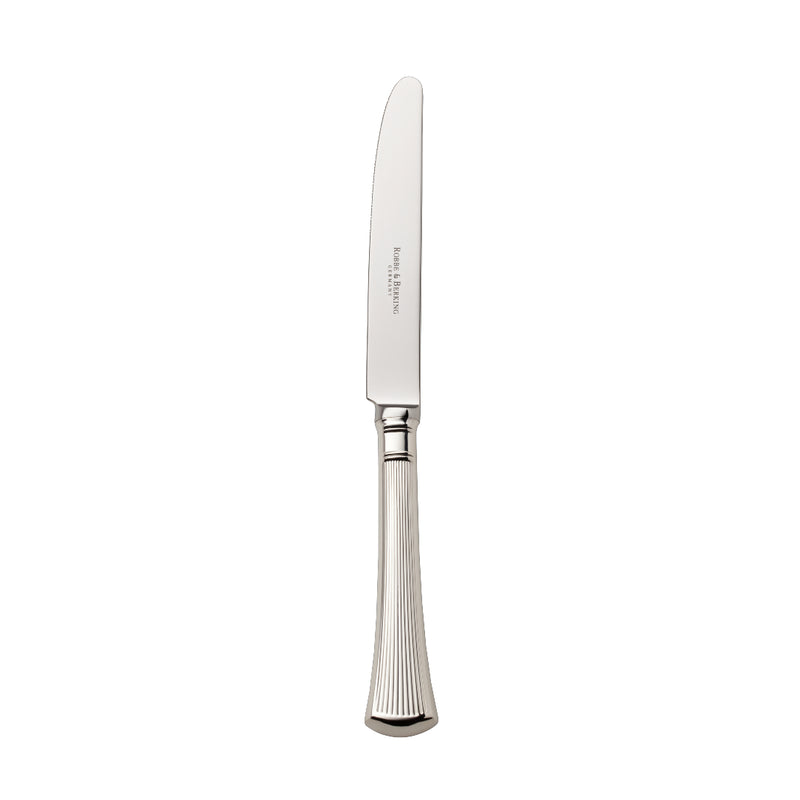 Silver-plated Avenue table knife with polished blade and sculpted ridges on elegant table.