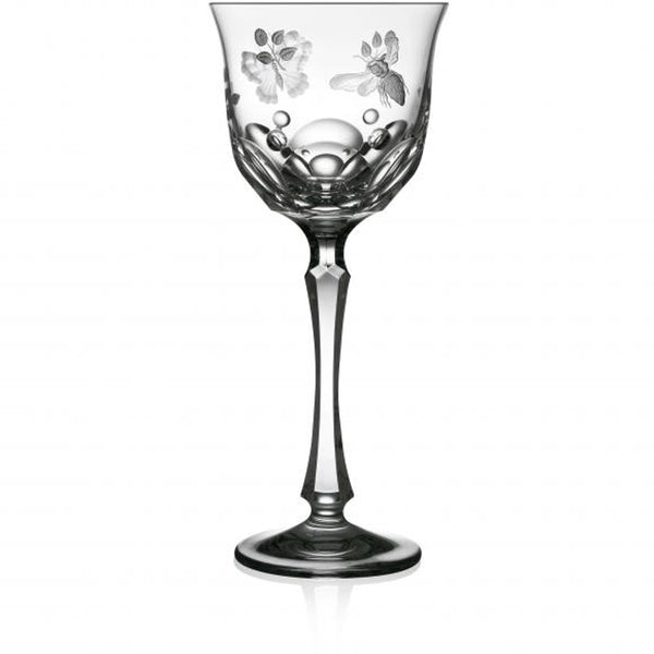 A clear hand-cut, hand-engraved art crystal glass with a floral pattern, featuring a round shape with a flat cut base and detailed engraving of springtime creatures like butterflies and dragonflies.
