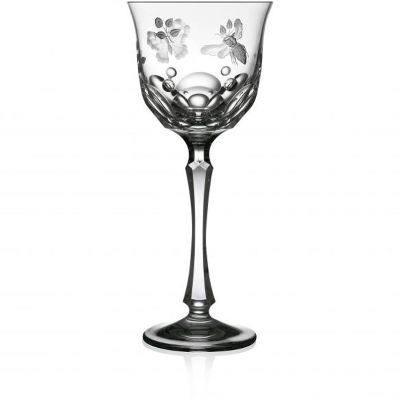 A clear hand-cut, hand-engraved art crystal glass with a floral pattern, featuring a round shape with a flat cut base and detailed engraving of springtime creatures like butterflies and dragonflies.