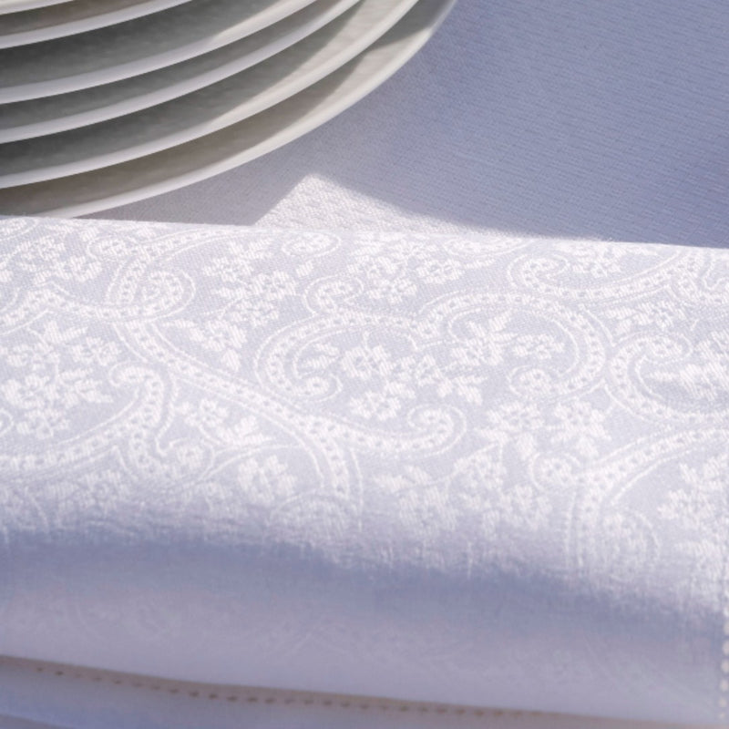 Portofino Fiori Linen Napkin in White by Le Jacquard Français close up on the texture