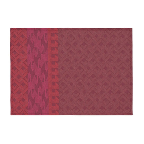 Red coated cotton placemat with retro inpired graphics by Le Jaquard Francais.