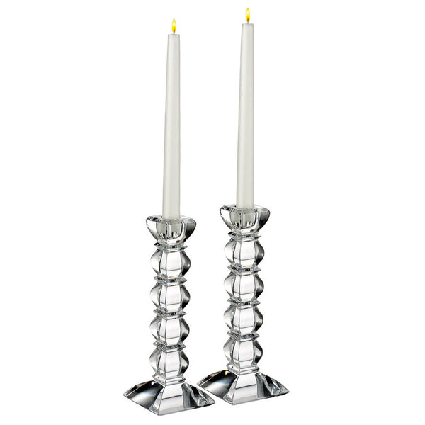 a pair of candlesticks with candles