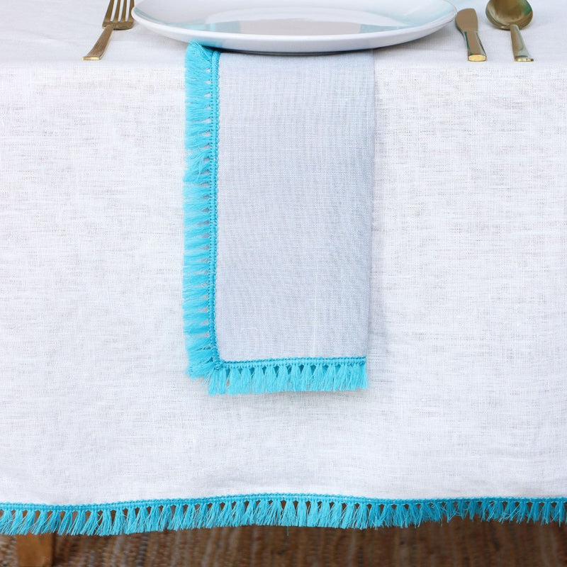 Santorini Tablecloth in White With Turquoise Fringe by Giardino Segreto