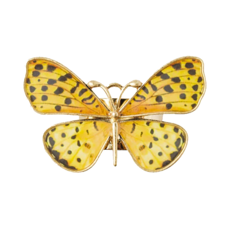 Top view of yellow butterfly napkin ring by Joanna Buchanan showing soft yellow tones and textured design