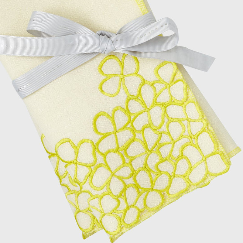 Hydrangea yellow linen napkin close-up showing hand-cut floral edging and embroidery, white background 