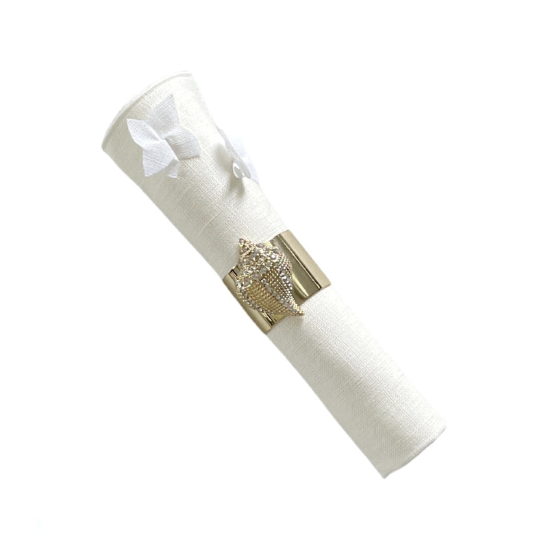 Jasmine Linen Napkin in White by Giardino Segreto styled with gold shell napkin ring