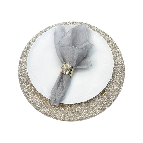Garza napkin in grey styled on silver placemat side view sold by Amiramour 