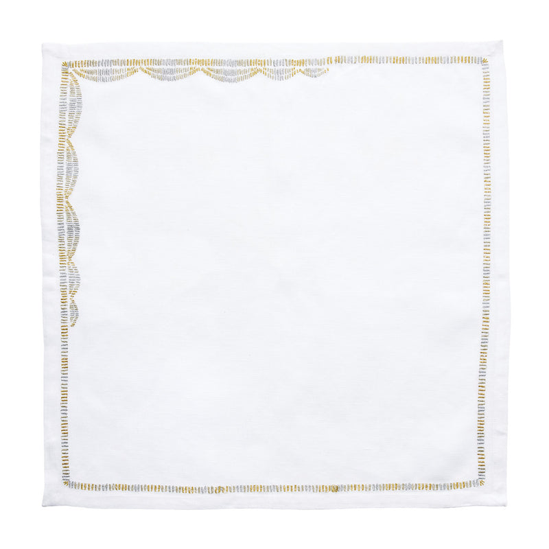 Patina embroidered linen napkin in white with gold and silver details open on white background